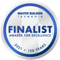 Round badge with the text “Master Builders Tasmania Finalist Awards for Excellence 2021 • 130 Years” in blue and gray on a white background.